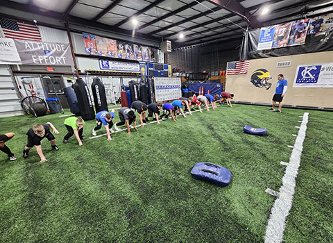 Kansas City Athlete Training Defensive Line Training Football Academy Group Classes and Private 1 on 1 Lessons for youth, middle school and high school football players looking to improve and excel at any defensive line position including rush defensive end with fundamentals being taught at the WeTrainKC Indoor Facility in Kansas City Missouri