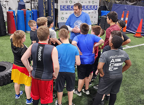 Kansas City Athlete Training Defensive Line Training Football Academy Group Classes and Private 1 on 1 Lessons for youth, middle school and high school football players looking to improve and excel at any defensive line position including rush defensive end with fundamentals being taught at the WeTrainKC Indoor Facility in Kansas City Missouri