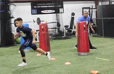 Running Back Football Training via Group Classes in Kansas City Missouri at Kansas City Athlete Training Football Academy offering Athletic Sports Performance Training for both youth and high school athletes.