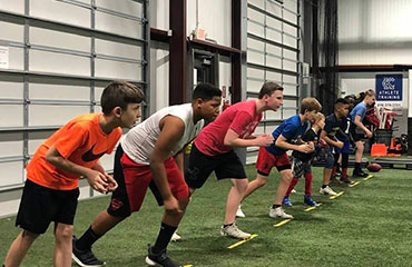 Wide Receiver Football Training via Group Classes in Kansas City Missouri at Kansas City Athlete Training Football Academy offering Athletic Sports Performance Training for both youth and high school athletes.