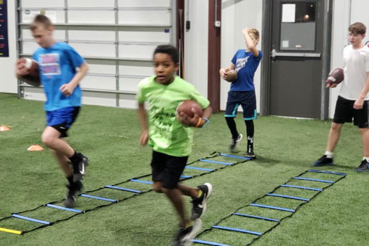 Running Back Football Training by Kansas City Athlete Training for both youth and high school athletes with group classes and private training along with camps and speed and agility classes for all sports and athletics in Kansas City Missouri