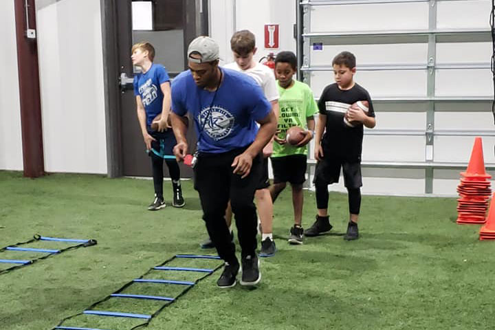 Running Back Football Training by Kansas City Athlete Training for both youth and high school athletes with group classes and private training along with camps and speed and agility classes for all sports and athletics in Kansas City Missouri