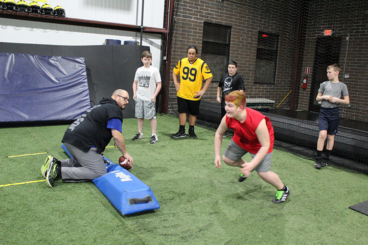 Defensive Line Football Training by Kansas City Athlete Training for both youth and high school athletes with group classes and private training along with camps and speed and agility classes for all sports and athletics in Kansas City Missouri