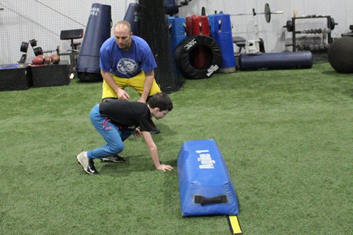 Defensive Line Football Training by Kansas City Athlete Training for both youth and high school athletes with group classes and private training along with camps and speed and agility classes for all sports and athletics in Kansas City Missouri