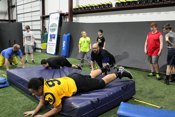 Defensive Line Football Training by Kansas City Athlete Training for both youth and high school athletes with group classes and private training along with camps and speed and agility classes for all sports and athletics in Kansas City Missouri