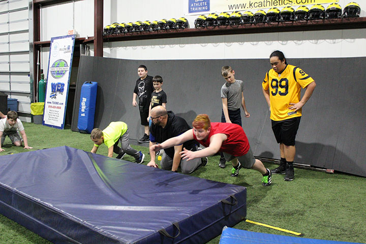 Defensive Line Football Training by Kansas City Athlete Training for both youth and high school athletes with group classes and private training along with camps and speed and agility classes for all sports and athletics in Kansas City Missouri