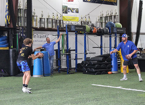 Kansas City Athlete Training Quarterback Football Academy Group Classes and Private QB 1 on 1 Lessons for youth, middle school and high school football players looking to improve and excel at the Quarterback position with fundamentals being taught at the WeTrainKC Indoor Facility in Kansas City Missouri