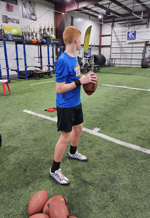 Kansas City Athlete Training Quarterback Football Academy Group Classes and Private QB 1 on 1 Lessons for youth, middle school and high school football players looking to improve and excel at the Quarterback position with fundamentals being taught at the WeTrainKC Indoor Facility in Kansas City Missouri