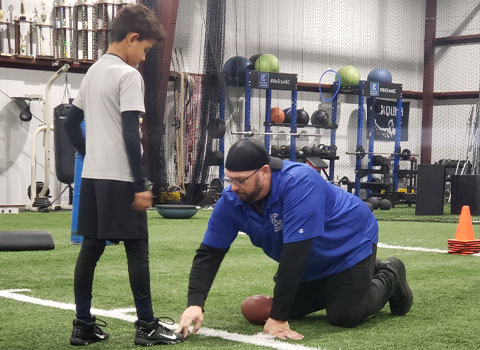 Kansas City Athlete Training Quarterback Football Academy Group Classes and Private QB 1 on 1 Lessons for youth, middle school and high school football players looking to improve and excel at the Quarterback position with fundamentals being taught at the WeTrainKC Indoor Facility in Kansas City Missouri