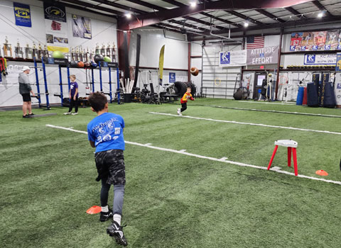 Kansas City Athlete Training Quarterback Football Academy Group Classes and Private QB 1 on 1 Lessons for youth, middle school and high school football players looking to improve and excel at the Quarterback position with fundamentals being taught at the WeTrainKC Indoor Facility in Kansas City Missouri